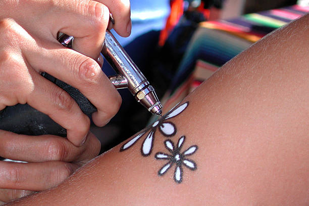 Getting an Airbrushed tattoo.